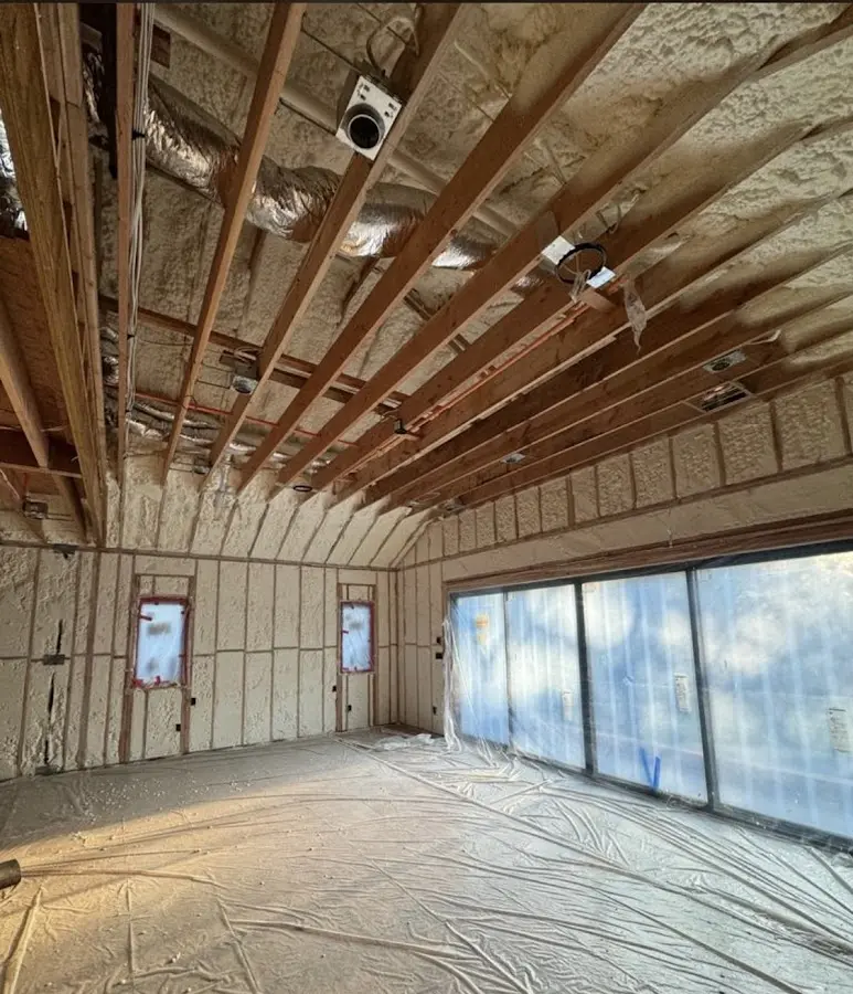 Interior walls and ceiling insulated with spray foam during new construction in Charlottesville